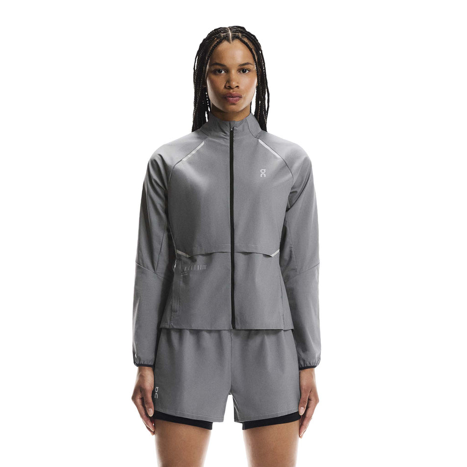 Front view of a model wearing the On Women's Weather Jacket Lumos in the Eclipse colourway. (8790034808994)