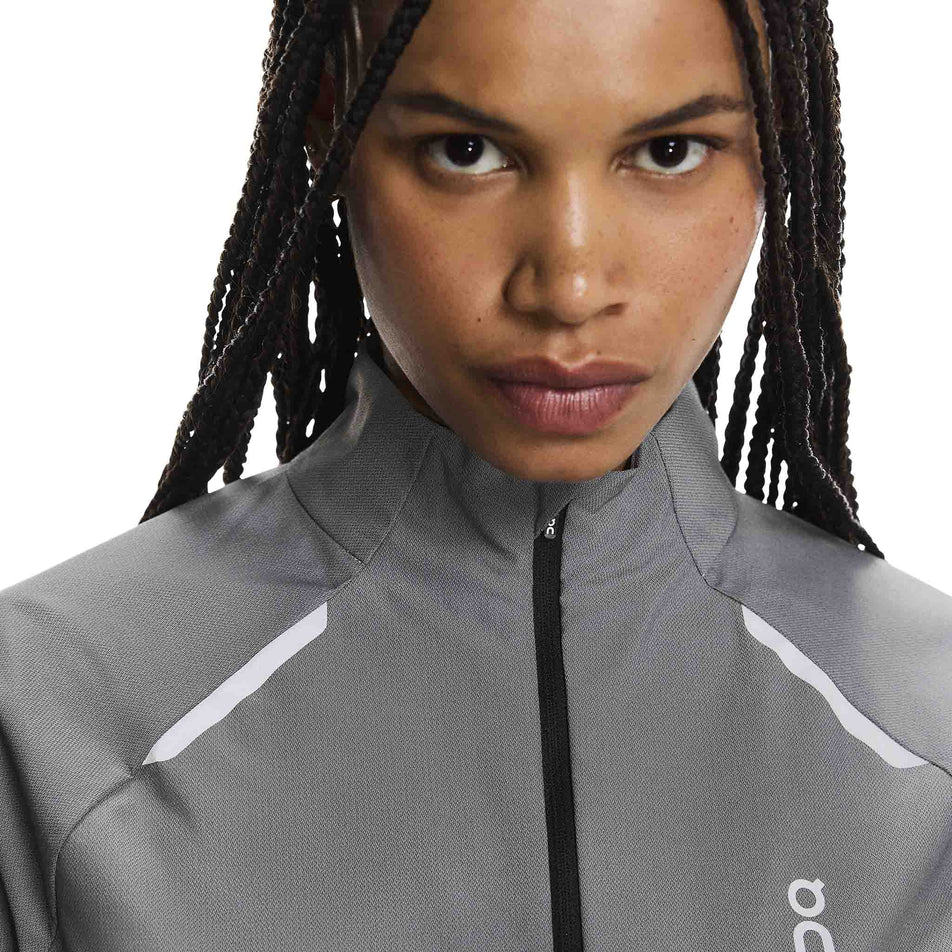 Front view of a model wearing the On Women's Weather Jacket Lumos in the Eclipse colourway. (8790034808994)
