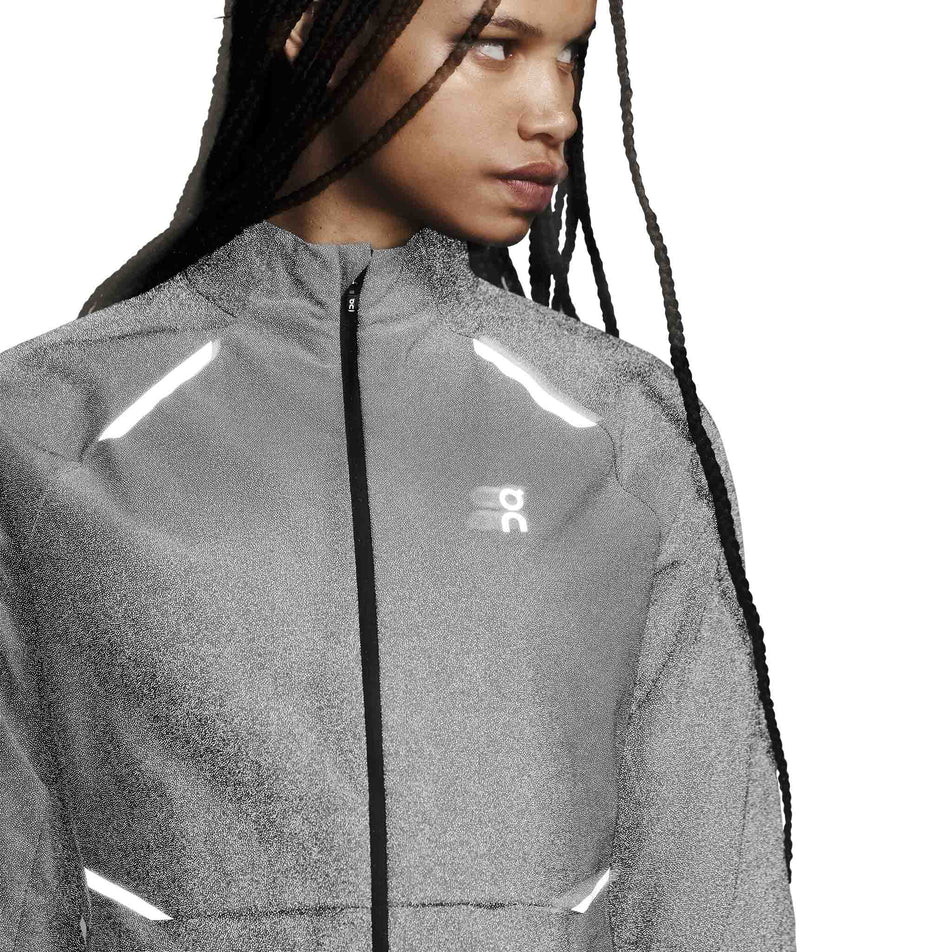 Front view of a model wearing the On Women's Weather Jacket Lumos in the Eclipse colourway. (8790034808994)