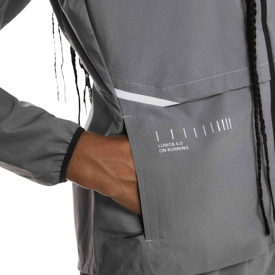 Close-up view of the side pocket on the On Women's Weather Jacket Lumos in the Eclipse colourway. (8790034808994)