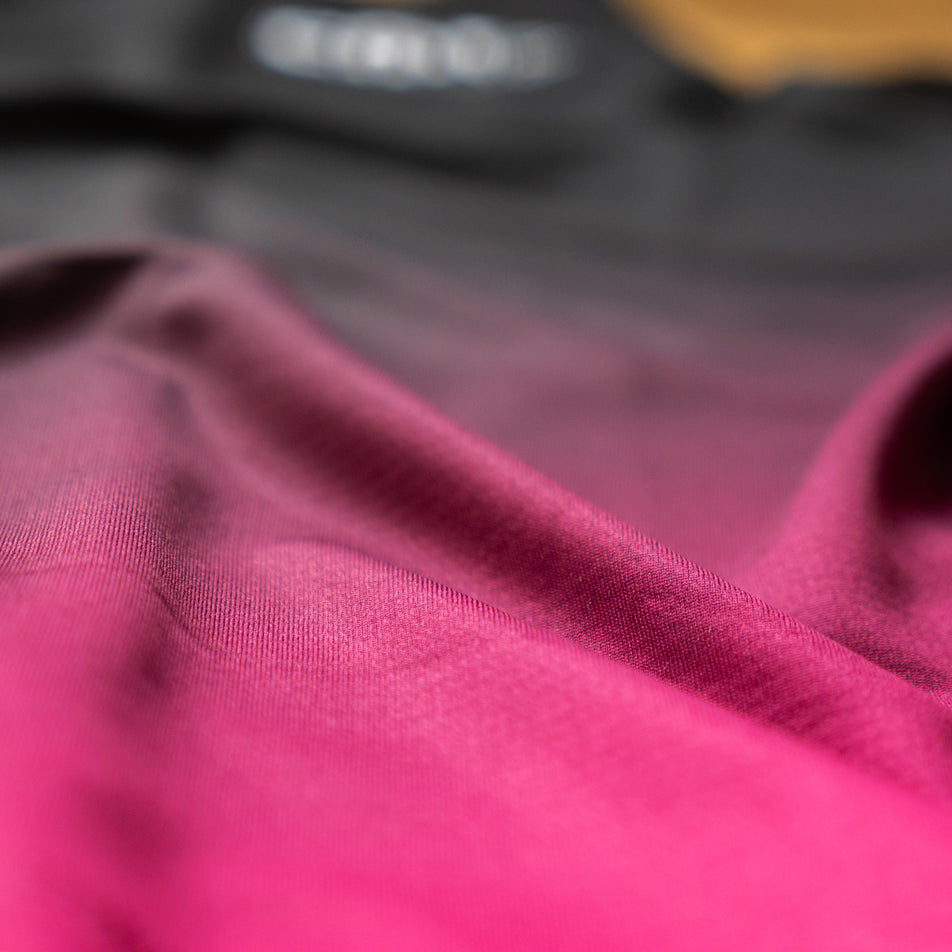 Close-up view of the fabric on the EMF Official Licensed Merchandise | Pressio Women's Prevail Singlet in the Black/Pink colourway.