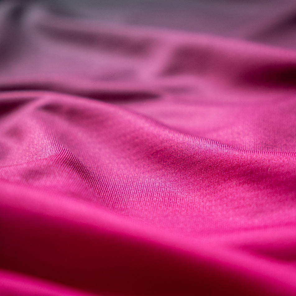 Close-up view of the fabric of the EMF Official Licensed Merchandise | Pressio Men's Prevail Singlet in the Black/Pink colourway.