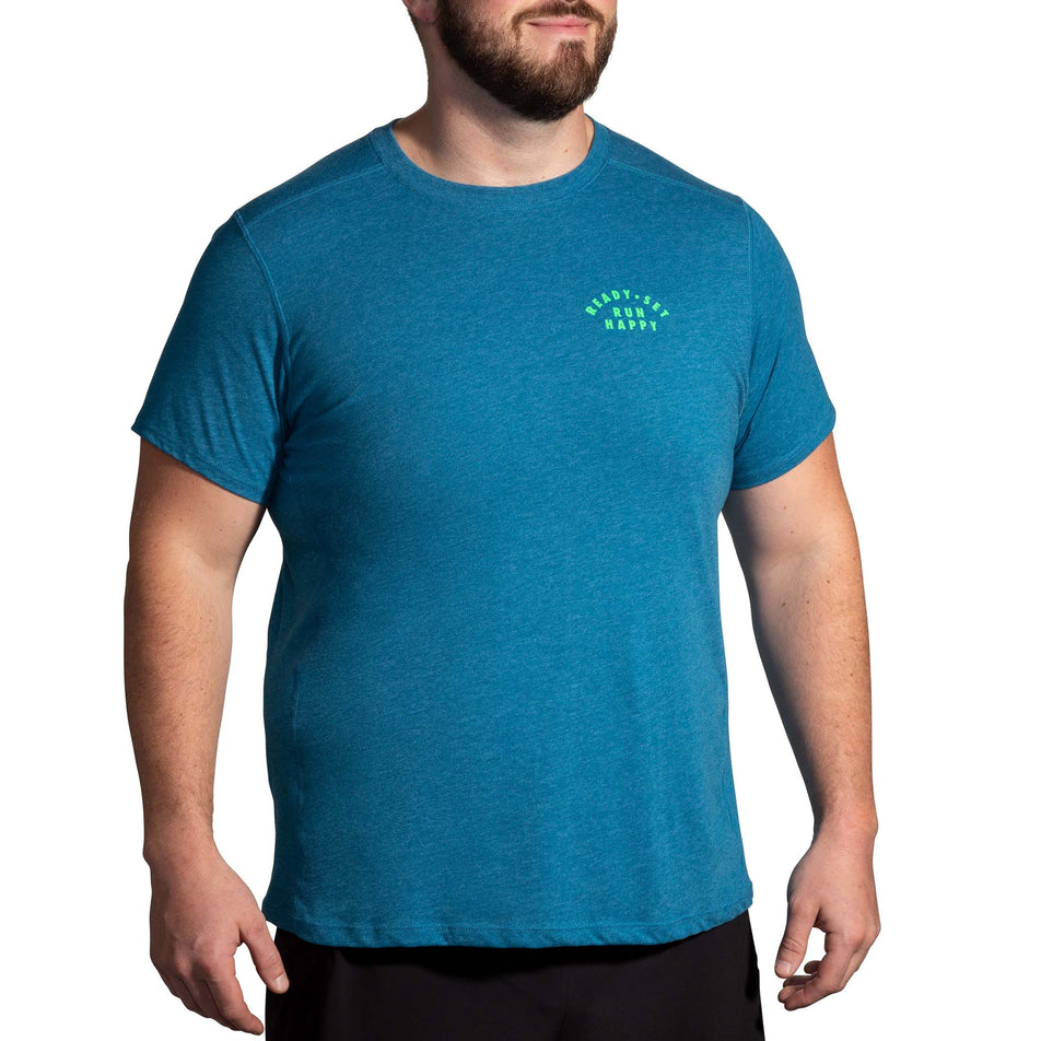 Front view of a model wearing a Brooks Men's Distance Short Sleeve 2.0 Running T-shirt in the Heather Dark Ocean/Ready Set Run Happy colourway (8007464091810)