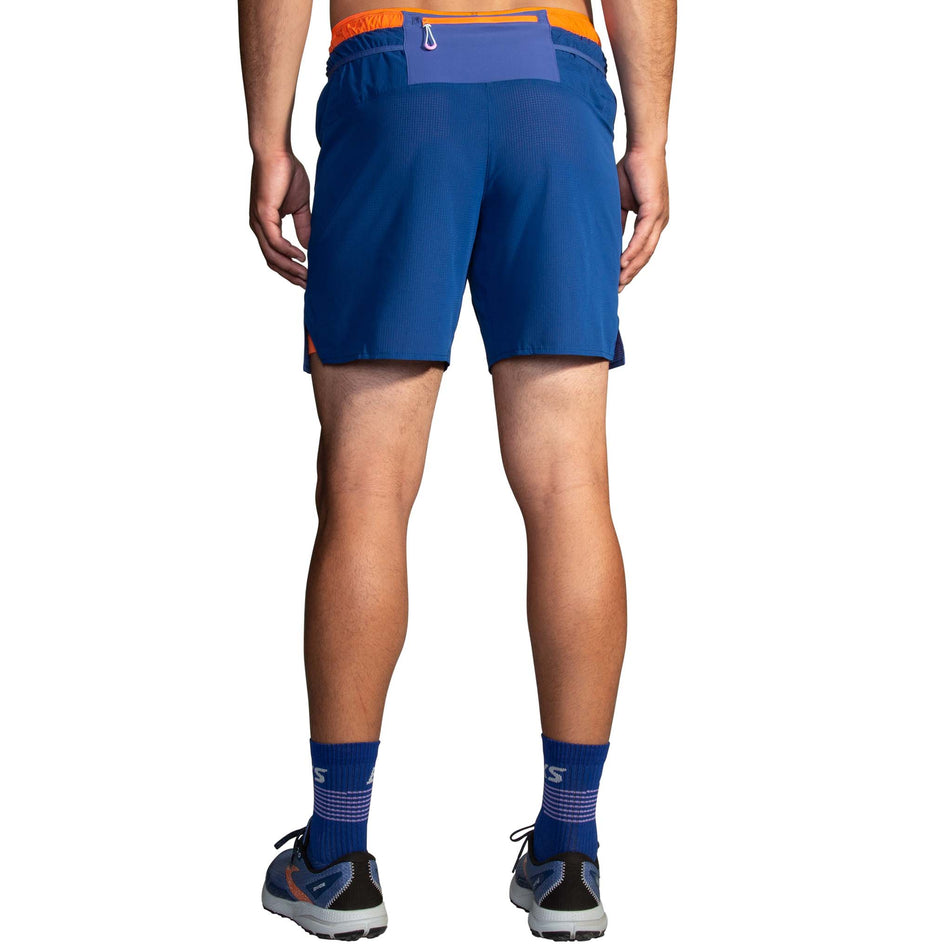 Back view of model wearing a pair of Brooks Men's High Point 7