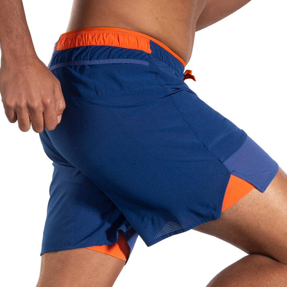 Right-side view of model wearing a pair of Brooks Men's High Point 7