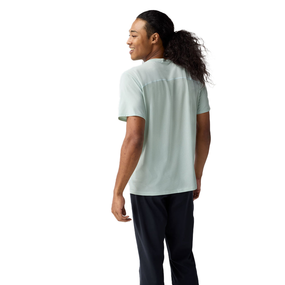 Back view of a model wearing the Brooks Men's Atmosphere Short Sleeve 3.0 in the Smoke/Shadow Stripe colourway. (8718760607906)