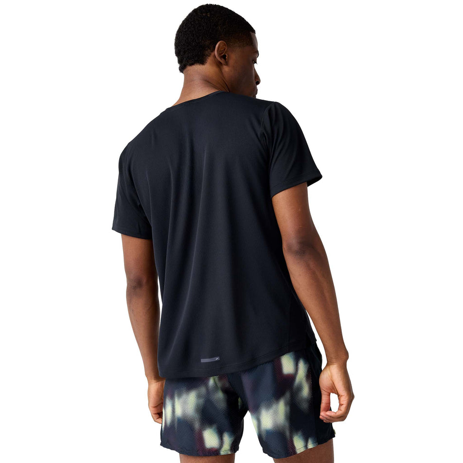 Back view of a model wearing the Brooks Men's Dash Short Sleeve in the Black colourway.