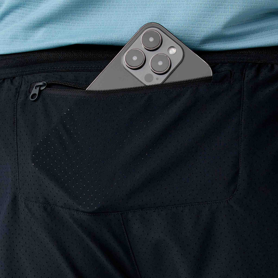 The zippered pocket on the back of the Brooks Men's Dash Cooling Short in the Black colourway.