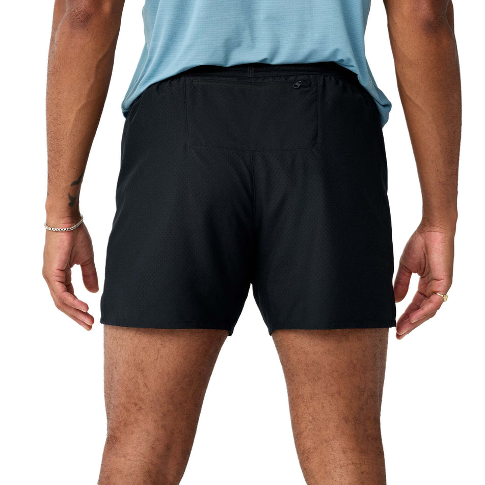Back view of a model wearing the Brooks Men's Dash Cooling Short in the Black colourway.