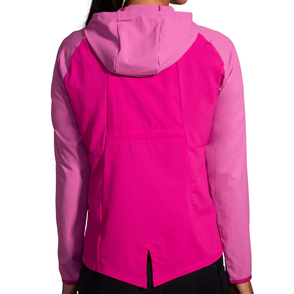 Back view of a model wearing a Brooks Women's Canopy Jacket in the Frosted Mauve/Mauve colourway (8007491748002)