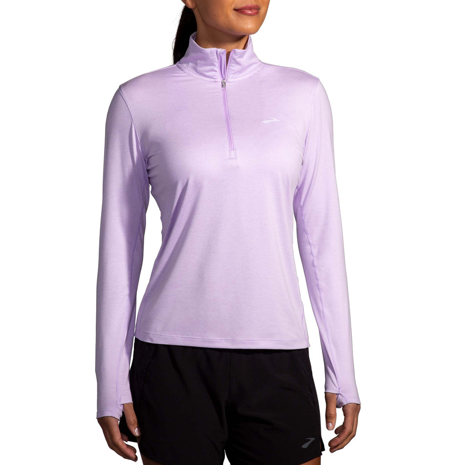 Front view of a model wearing a Women's Dash 1/2 Zip 2.0 in the Heather Purple colourway. Model is also wearing Brooks shorts.  (8177476665506)