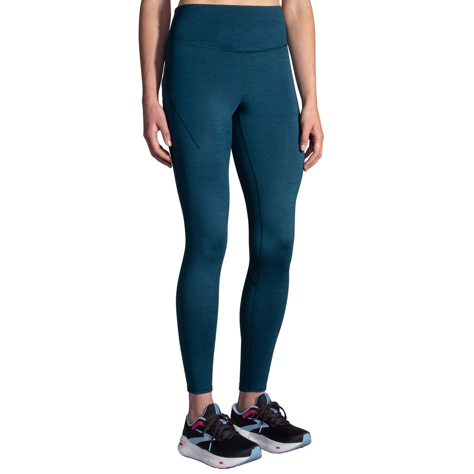 Front view of a model wearing the Women's Spark Tight in the Heather Ocean Drive colourway. Model is also wearing Brooks running shoes.  (8177464017058)