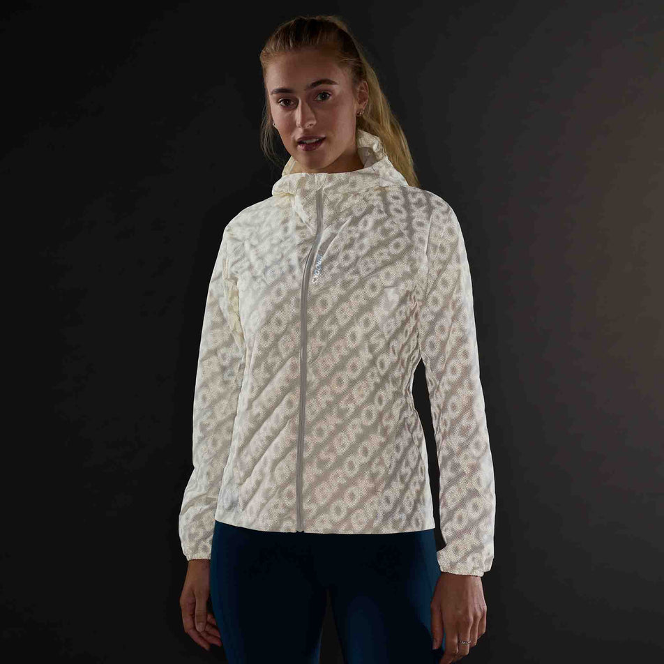 The reflective print on the Brooks Women's Canopy Reflective Jacket in the Reflective Wordmark Bone colourway.