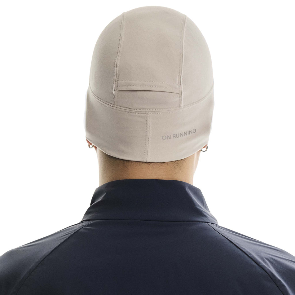 Back view of a model wearing the On Core Beanie in the Truffle colourway. (8717368000674)