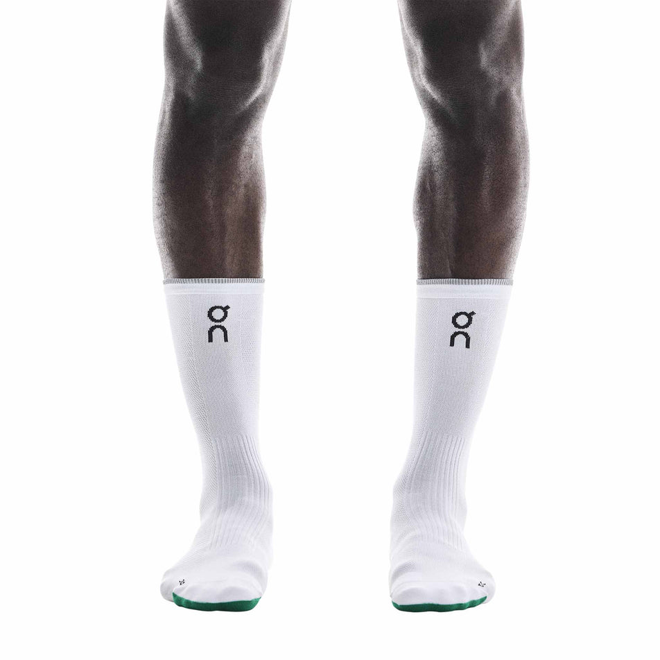 The On Running Socks that come with a pair of On Unisex Cloudmonster 3 Hyper LS Running Shoes in the Limelight/Bloom colourway.