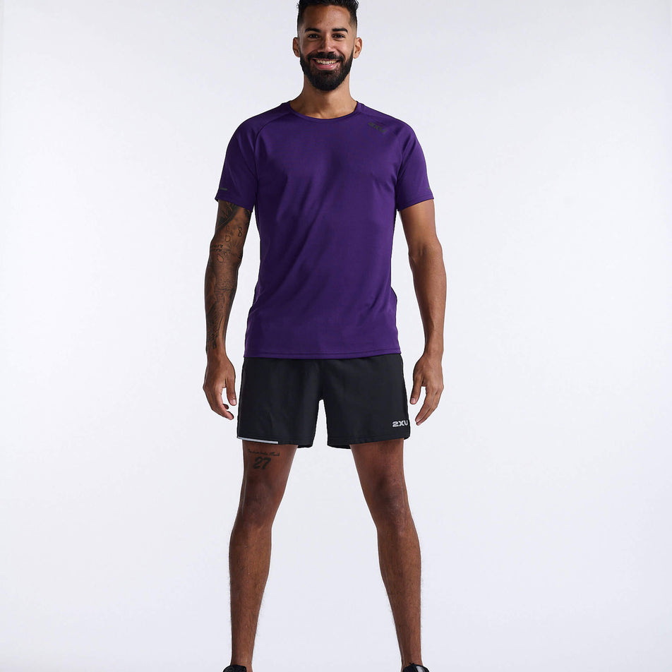Front view of a model wearing a 2XU Men's Aero Tee in the Acai/Black Reflective colourway. Model is also wearing 2XU shorts (8248600920226)