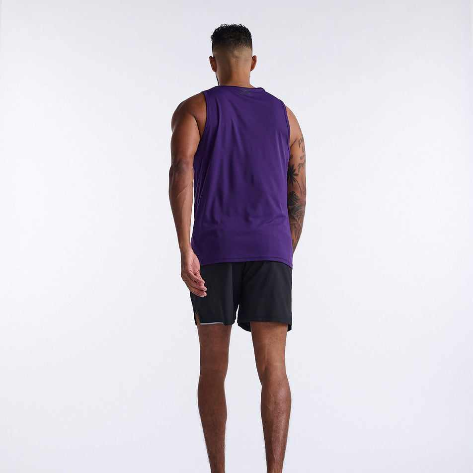 Back view of a model wearing a 2XU Men's Aero Tank in the Acai/Black Reflective colourway. Model is also wearing shorts. (8248599052450)