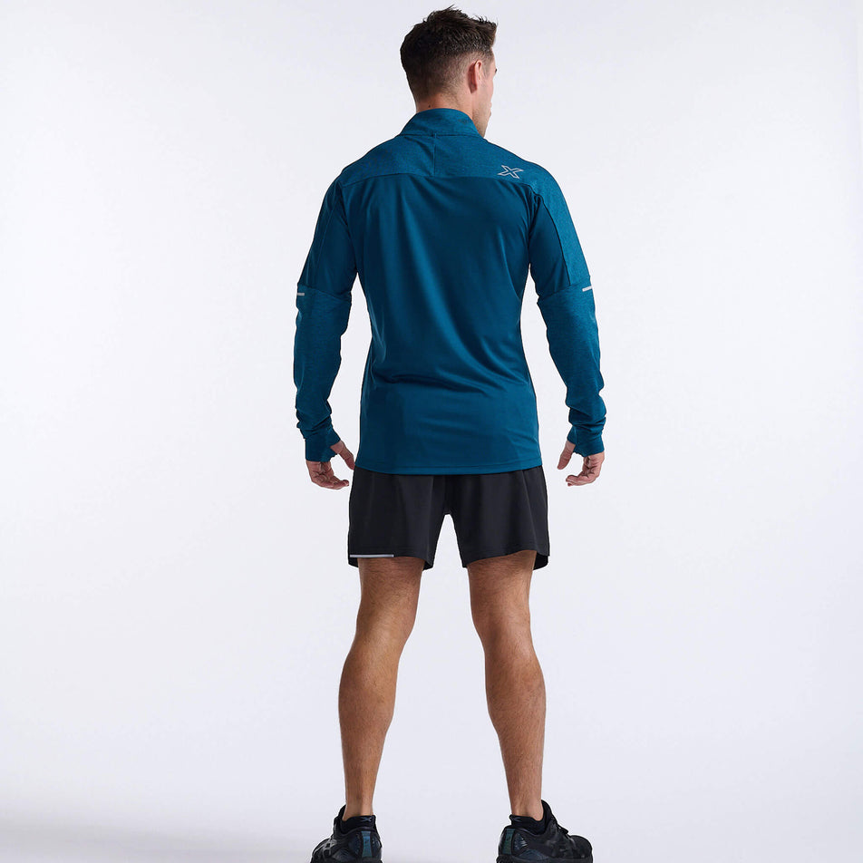 Back view of a model wearing a 2XU Men's Aero 1/2 Zip in the Majol/Silver Reflective colourway. Model is also wearing shoes and 2XU shorts. (8248600428706)