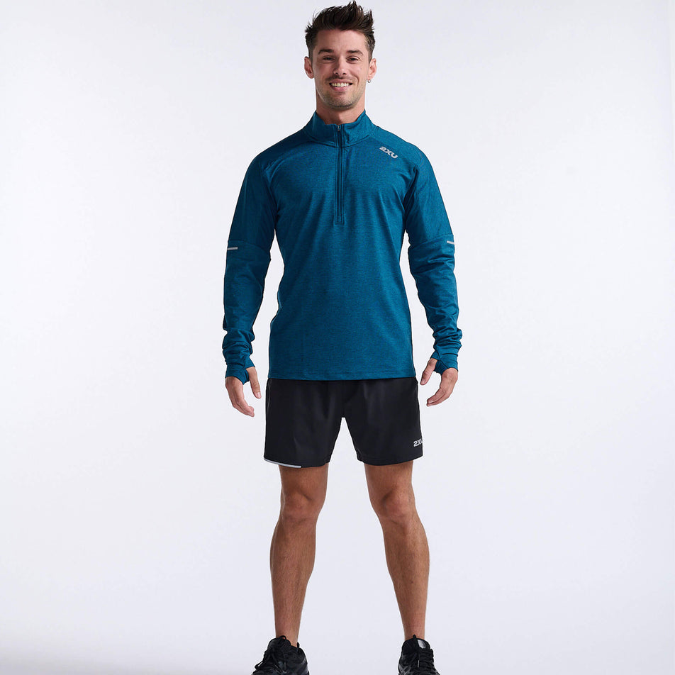 Front view of a model wearing a 2XU Men's Aero 1/2 Zip in the Majol/Silver Reflective colourway. Model is also wearing shoes and 2XU shorts. (8248600428706)