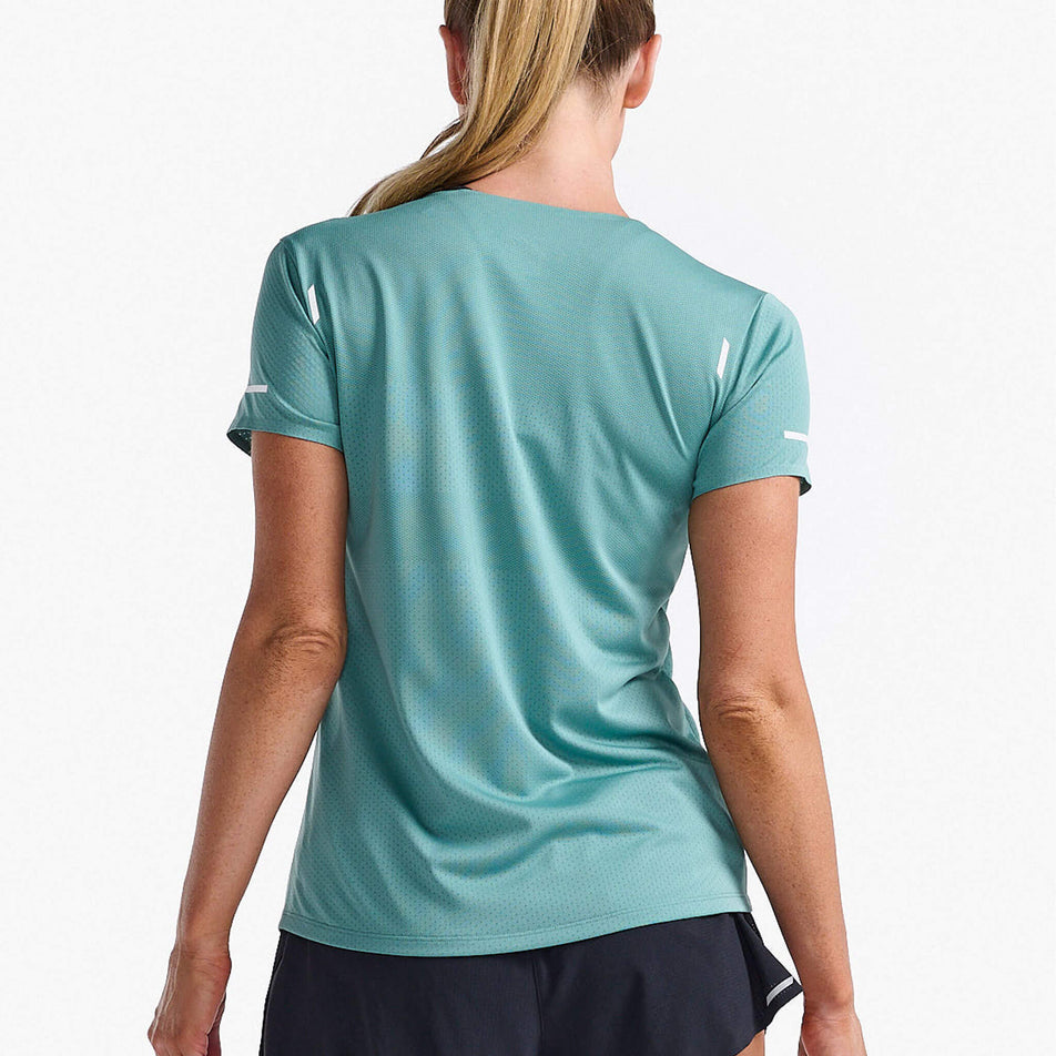 Back view of a model wearing a 2XU Women's Light Speed Tech Tee in the Raft/White Reflective colourway. Model is also wearing 2XU shorts. (8250156777634)