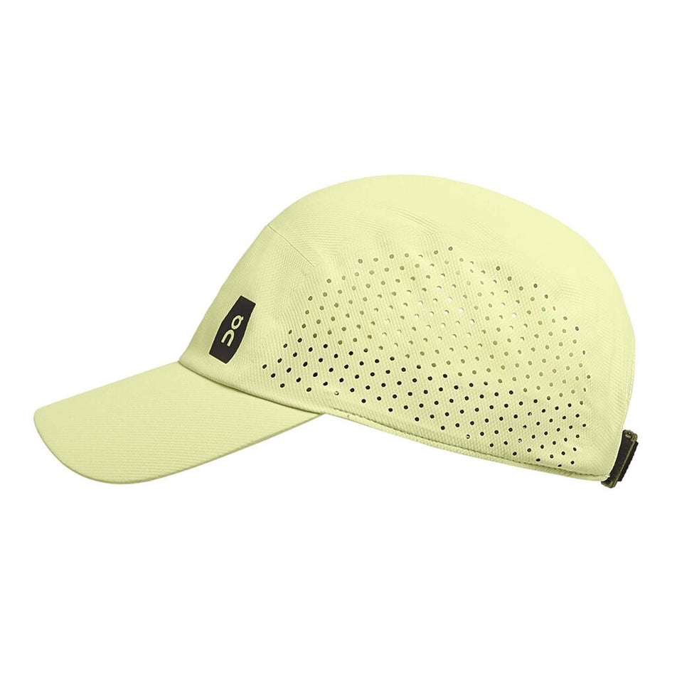 Side view of an On Unisex Lightweight Cap in the Hay colourway. On logo is visible.  (8008510144674)