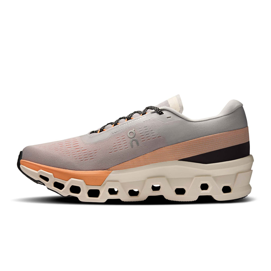 Medial view of the right shoe from a pair of On Men's Cloudmonster 2 Running Shoes in the Glacier/Tangerine colourway. (8714506862754)