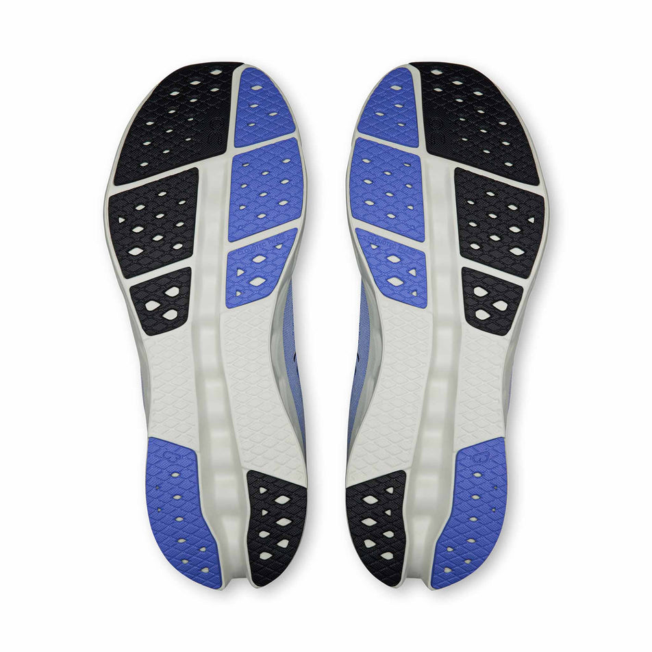 The outsoles of a pair of On Men's Cloudsurfer 2 Running Shoes in the Sailor/Ivory colourway.