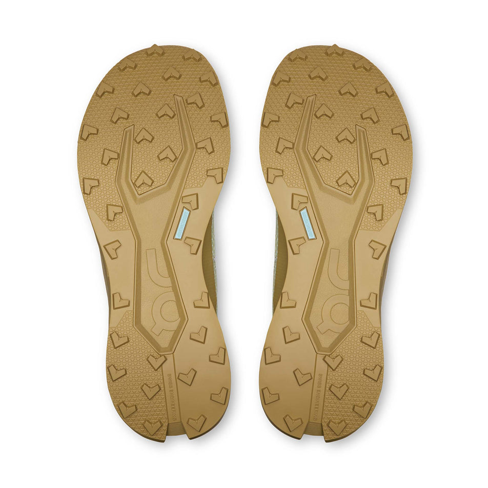 The outsoles of a pair of On Men's Cloudultra 3 Running Shoes in the Linen/Safari colourway.