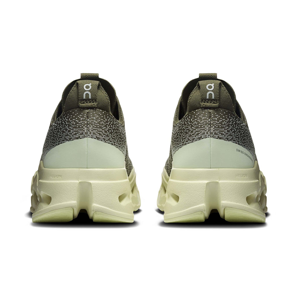 The back of a pair of On Men's Cloudsurfer Max Running Shoes in the Olive/Seedling colourway. 
