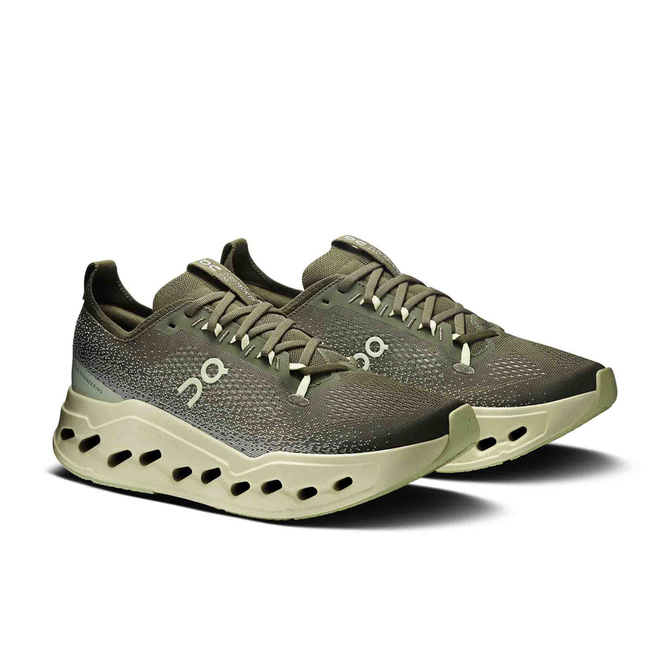 A pair of On Men's Cloudsurfer Max Running Shoes in the Olive/Seedling colourway. 