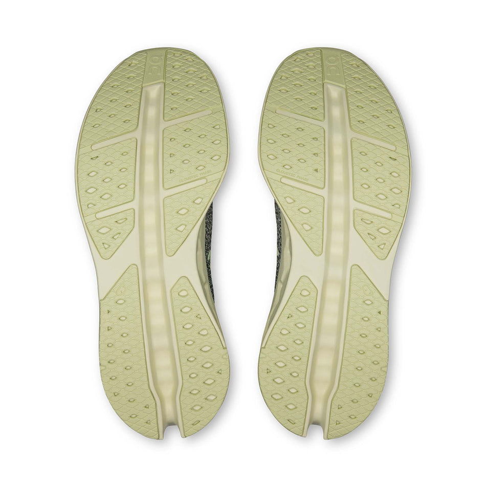 The outsoles of a pair of On Men's Cloudsurfer Max Running Shoes in the Olive/Seedling colourway. 
