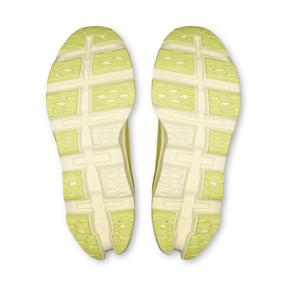 The outsoles of a pair of On Men's Cloudmonster 3 Running Shoes in the Limelight/Seedling colourway.