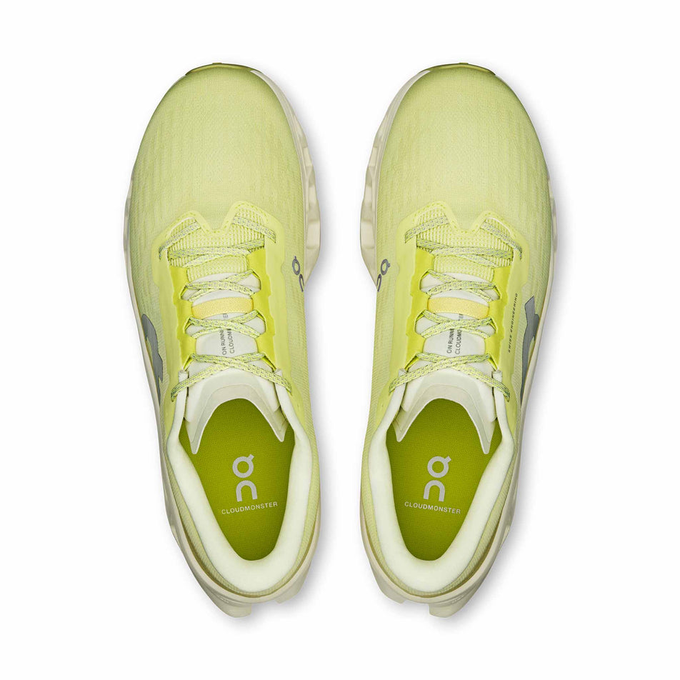 The uppers of a pair of On Men's Cloudmonster 3 Running Shoes in the Limelight/Seedling colourway.