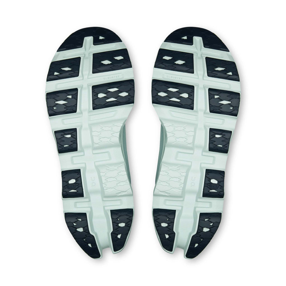 The outsoles of a pair of On Men's Cloudmonster 3 Running Shoes in the Brook/Flurry colourway.