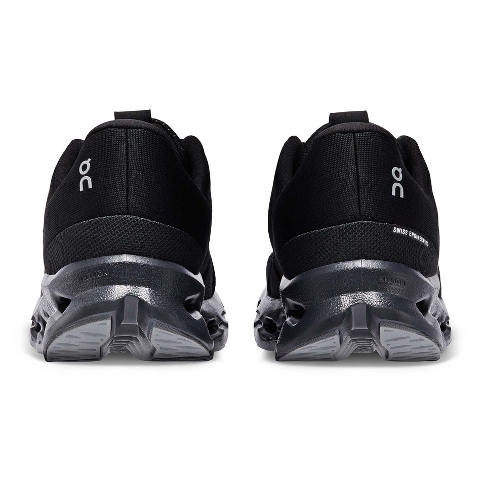 The back of a pair of On Women's Cloudsurfer Running Shoes in the All Black colourway (7986199756962)