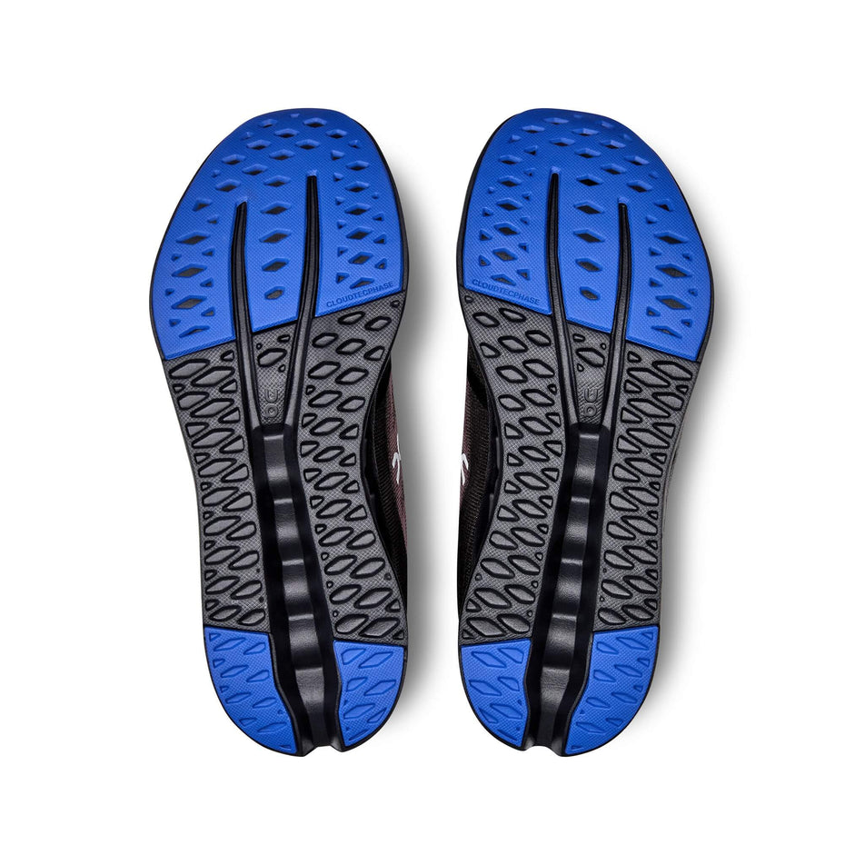 Outsoles on a pair of On Women's Cloudsurfer Running Shoes in the Black/Cobalt colourway (8132660330658)