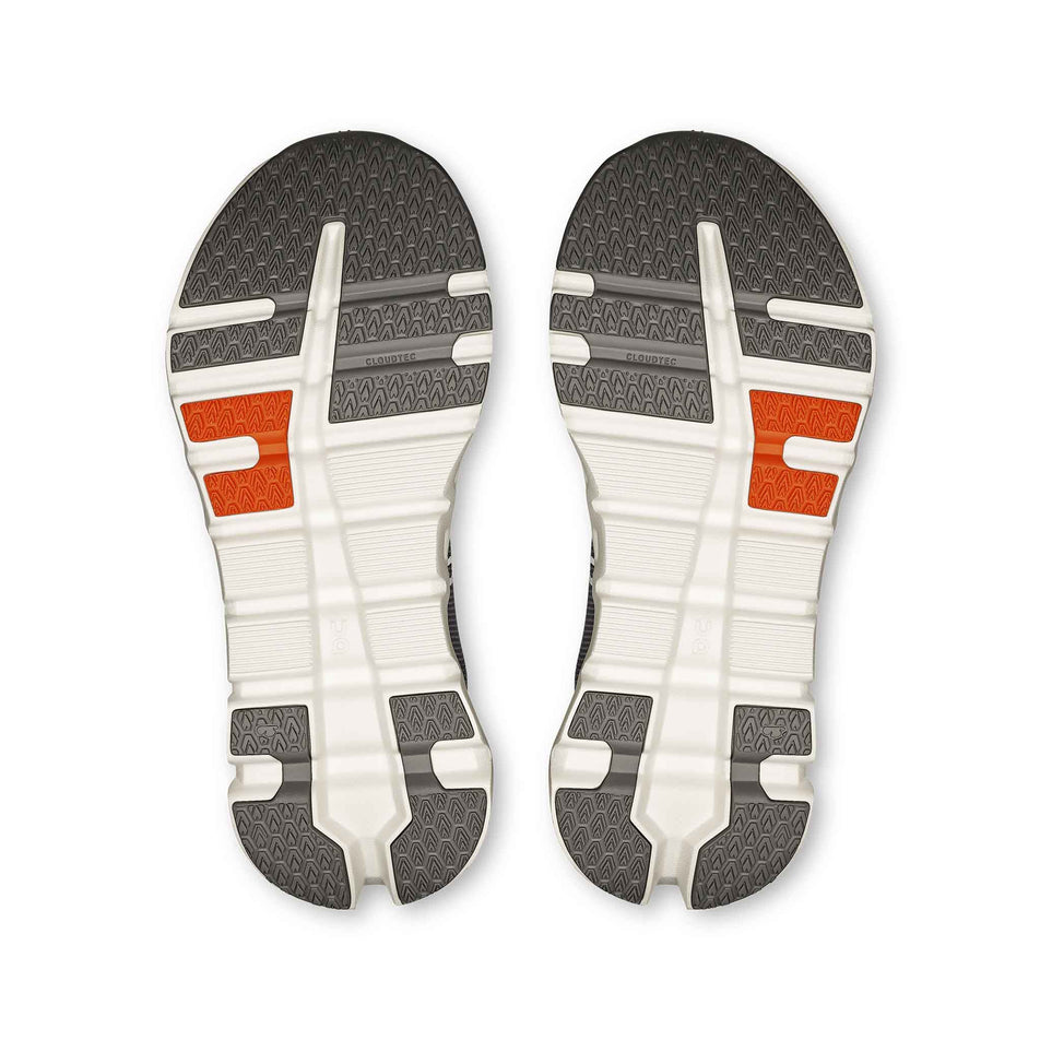 The outsoles of a pair of On Women's Cloudrunner 2 Running Shoes in the Lilac/Ivory colourway. (8714536845474)