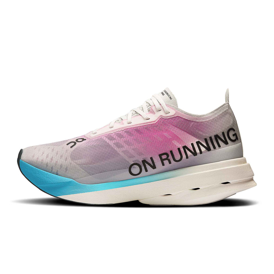 Medial view of the right shoe from a pair of On Women's Cloudboom Strike Running Shoes in the White/Horizon colourway. (8714514890914)