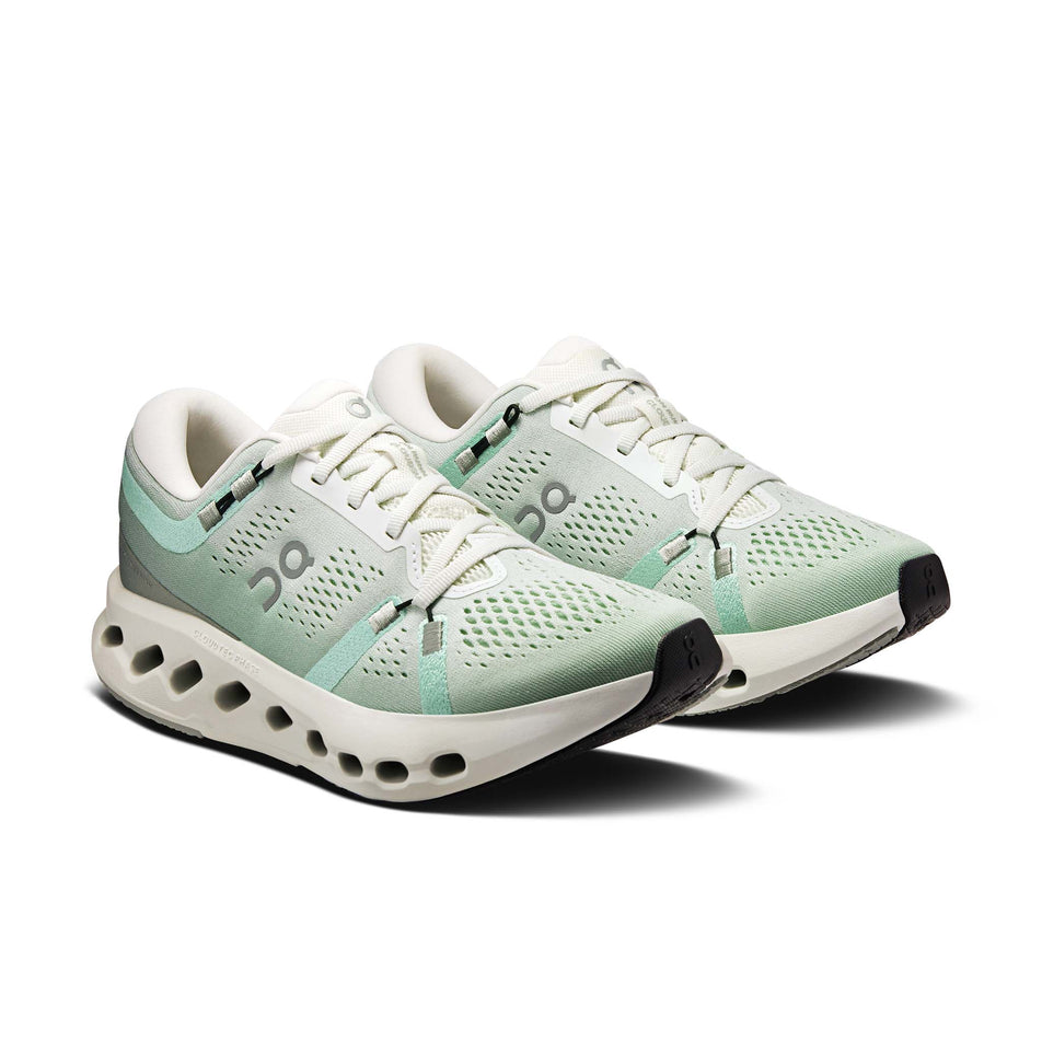 A pair of On Women's Cloudsurfer 2 Running Shoes in the Ivory/Creek colourway.