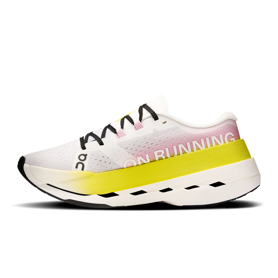 Medial view of the right shoe from a pair of On Women's Cloudboom Max Running Shoes in the Lime/Raspberry  colourway. (8746029416610)