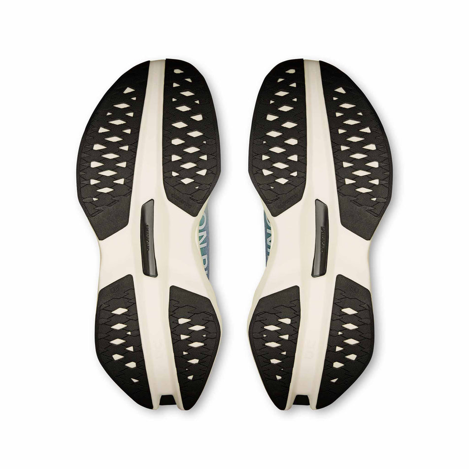 The outsoles of a pair of On Women's Cloudboom Max Running Shoes in the Honeydrew/Lilac colourway. (8714923344034)