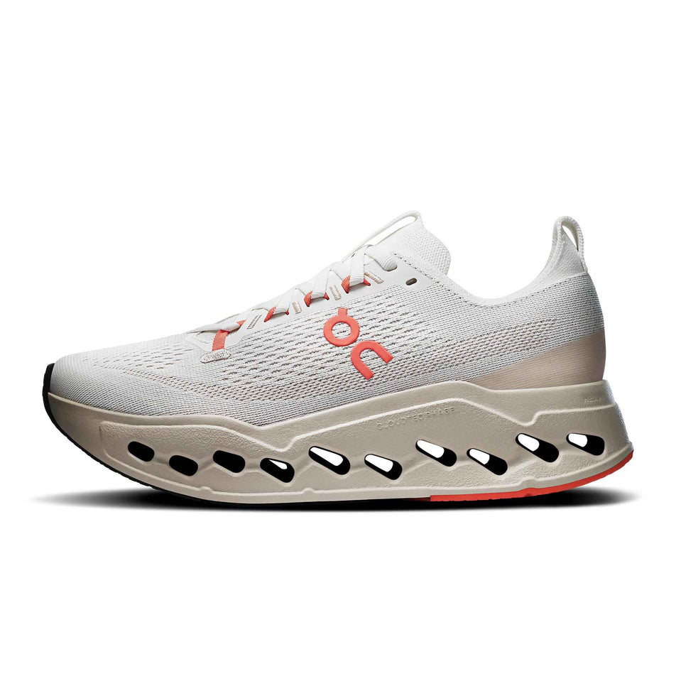 Medial view of the right shoe from a pair of On Women's Cloudsurfer Max Running Shoes in the Ivory/Salmon colourway. (8714533634210)