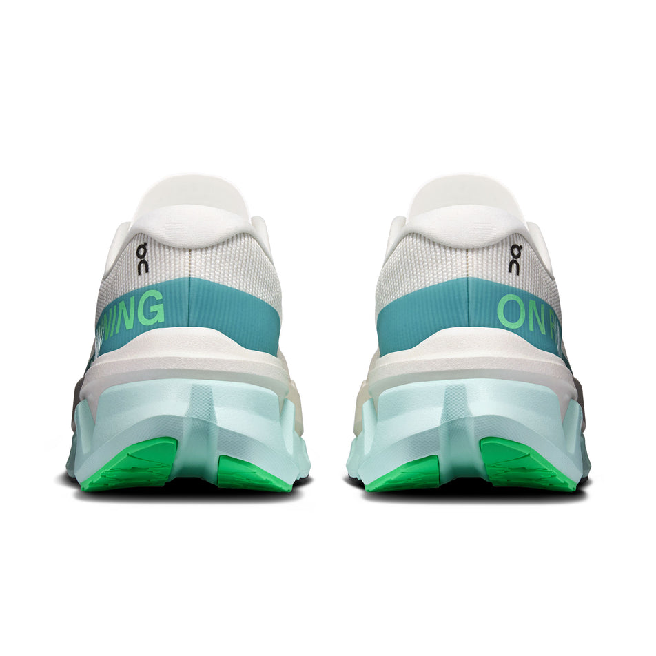 The back of a pair of On Women's Cloudmonster 3 Hyper Running Shoes in the Ivory/Flurry colourway.