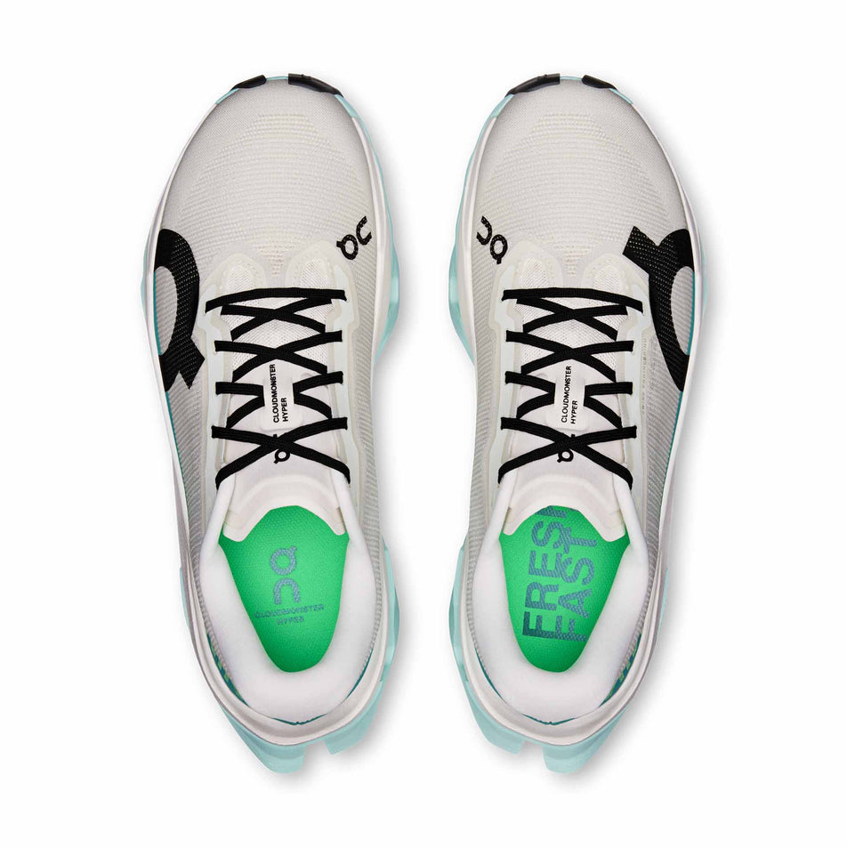 The uppers of a pair of On Women's Cloudmonster 3 Hyper Running Shoes in the Ivory/Flurry colourway.