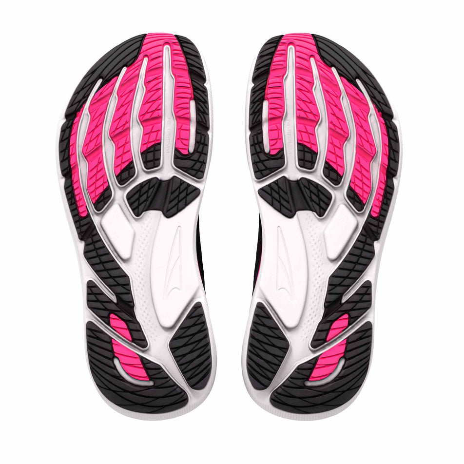 The outsoles of a pair of Altra Women's FWD VIA 2 Running Shoes in the Black/Silver/Knockout Pink colourway.