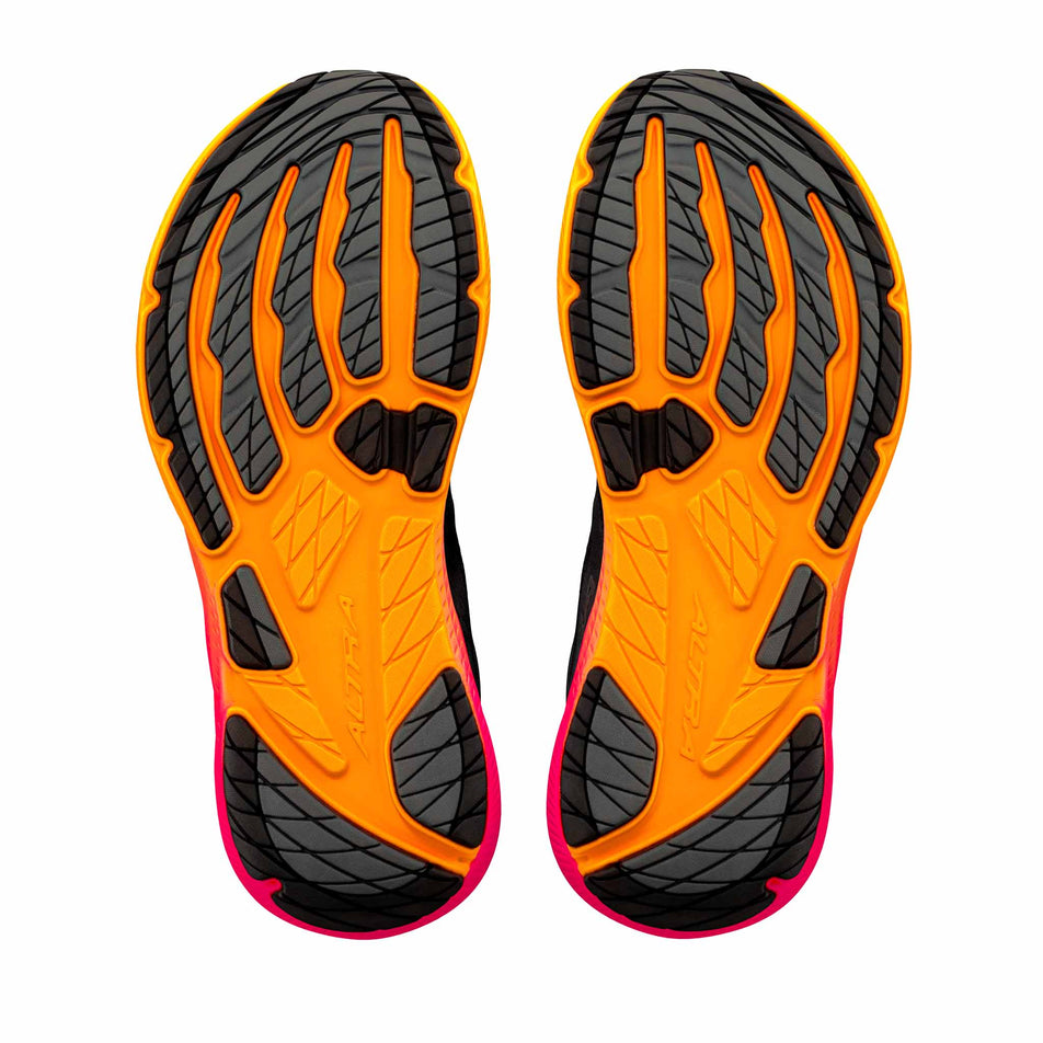 The outsoles of a pair of Altra Women's Experience Flow 3 Running Shoes in the Black/Black/Pink Glow colourway.