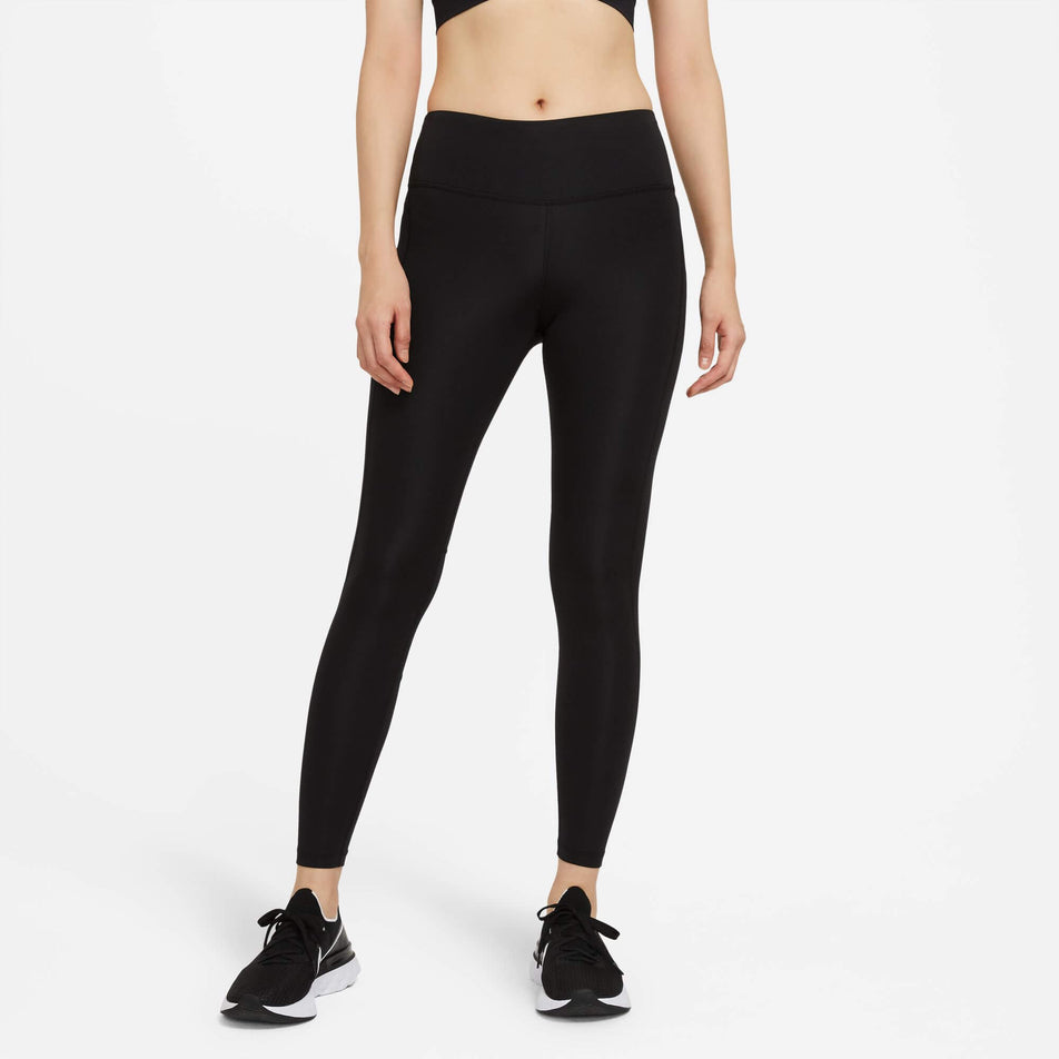 Front view of a model wearing a pair of Nike Women's Epic Fast Mid-Rise Pocket Running Leggings in the Black/Reflective Silv colourway (8049598562466)