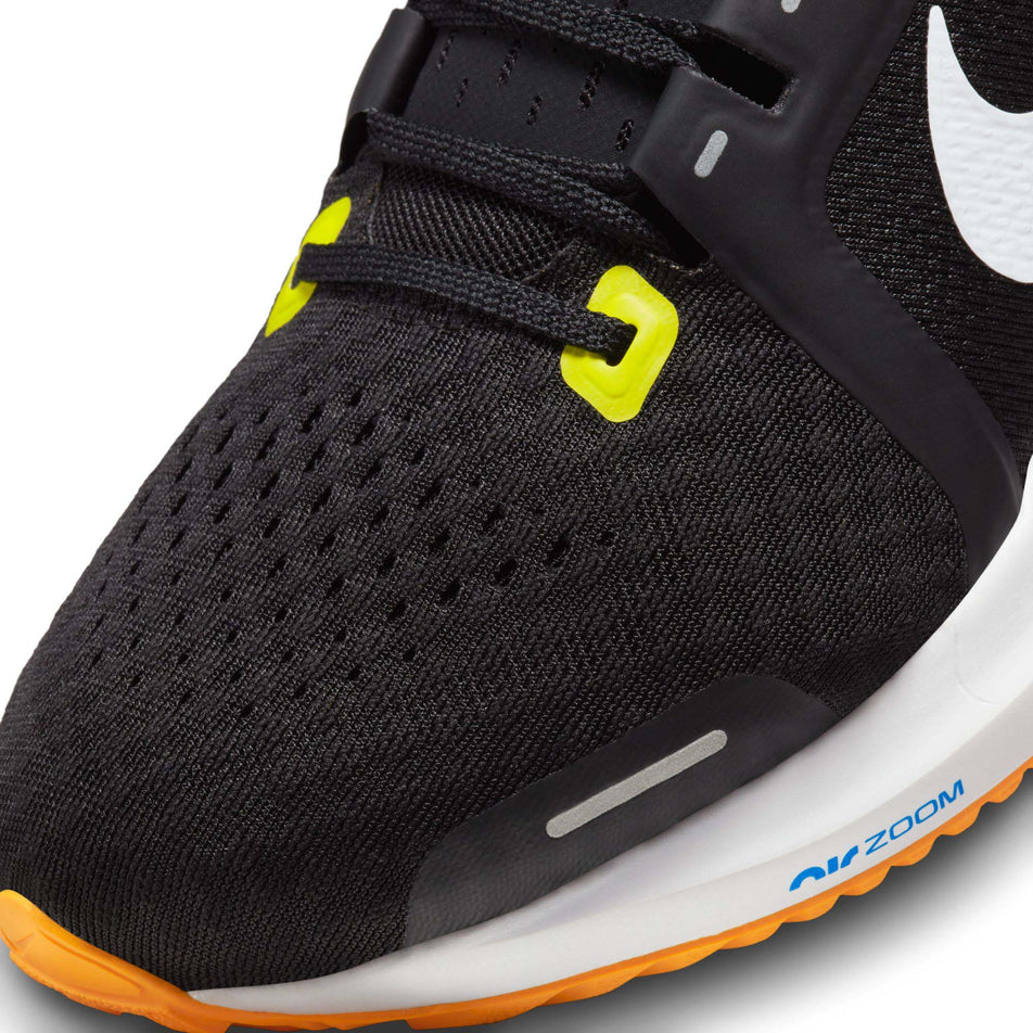 Lateral side of the toe box on the left shoe from a pair of Nike Men's Vomero 16 Road Running Shoes in the Black/White-Sundial-High Voltage colourway (7970516500642)