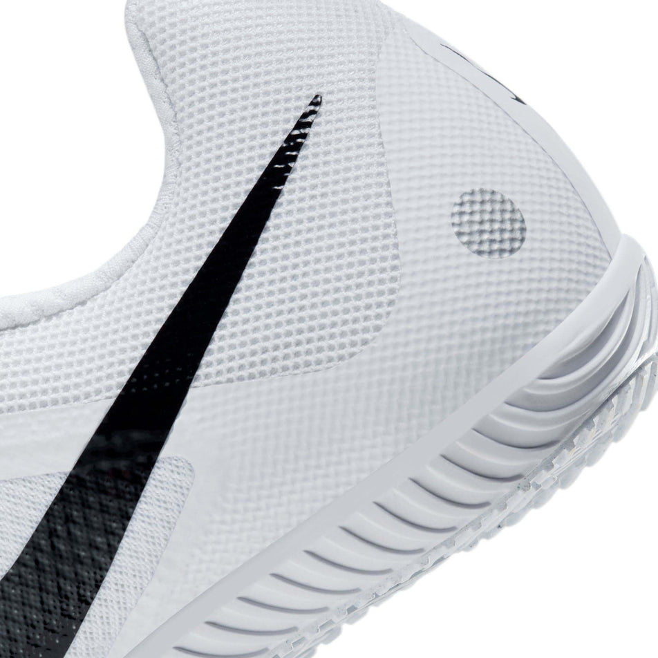 Lateral side of the back of the left shoe from a pair of Nike Rival Multi Track & Field Multi-Event Spikes in the White/Black-Metallic Silver colourway (8049514152098)