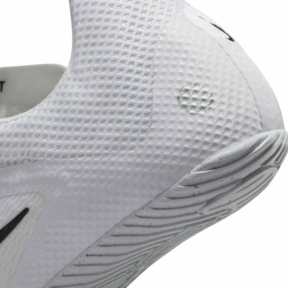 Lateral side of the back of the left shoe from a pair of Nike Unisex Rival Sprint Track & Field Sprinting Spikes in the White/Black-Metallic Silver colourway (8049489543330)